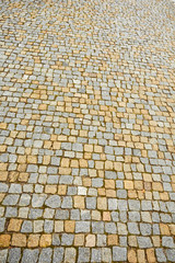 Fototapeta premium Background from paving stones. Cobblestone paving
