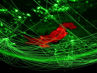 Pakistan on green model of planet Earth with network representing green age, travel and communication.