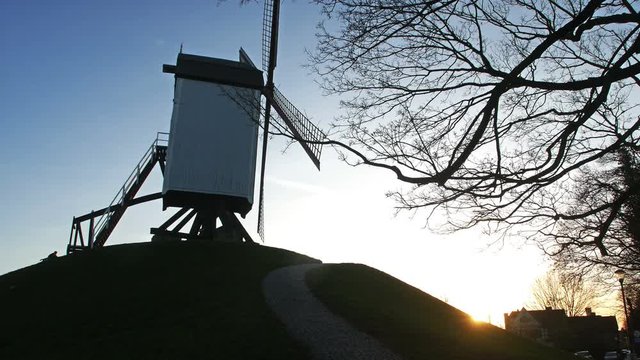 Brugge, Belgium : mill at sunset tilt view