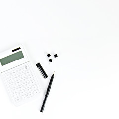 calculator and pen in white background