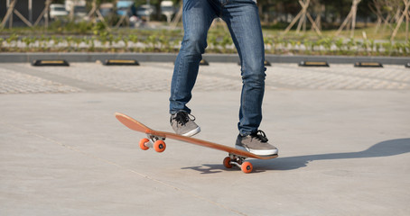 Skateboarder  skateboarding  on parking lot