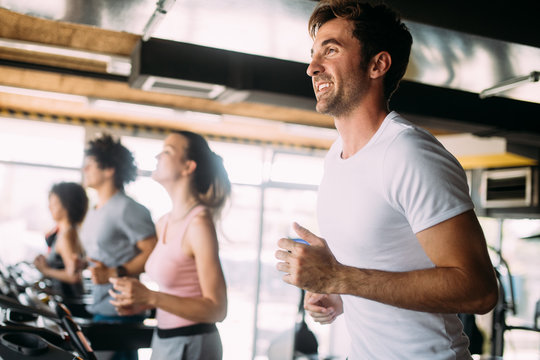 Picture of cheerful fitness team in gym