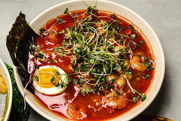 Tasty Chinese soup in bowl on table