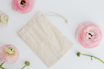 drawstring pouch and flower in white background
