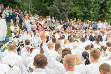 Many men and women pray to Jesus.
