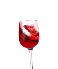 Glass with red splashing wine on white background