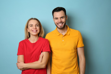 Fototapeta premium Stylish young couple on color background