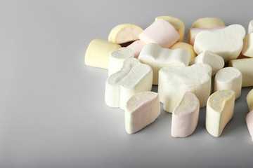Tasty marshmallows on grey background