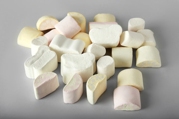 Tasty marshmallows on grey background