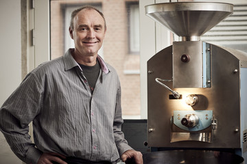 Barista roasting coffee beans 