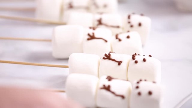 Step by step. Making marshmallow snowman on sticks hot chocolate toppers for food gifting.