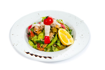 Fresh seafood salad at restaurant isolated on white