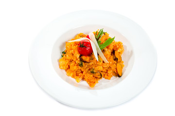 Seafood risotto with mussel shrimp and squid isolated on white