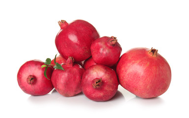 Ripe pomegranates on white background