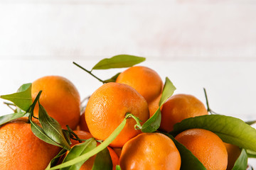 Tasty tangerines on light background