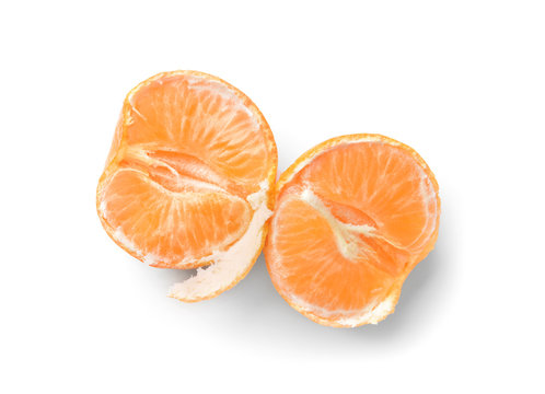 Halves of juicy tangerine on white background