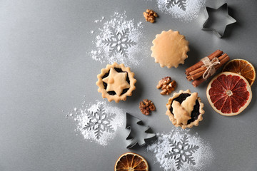Composition with tasty mince pies on table