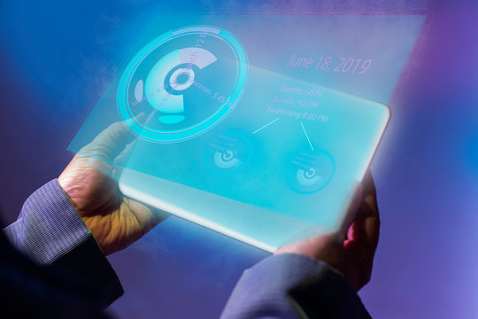 Holding digital tablet with productvity hollogram. Isolated on future digital technology concept.