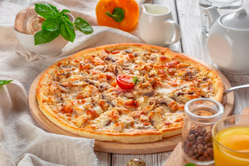 Delicious fresh pizza served on wooden table