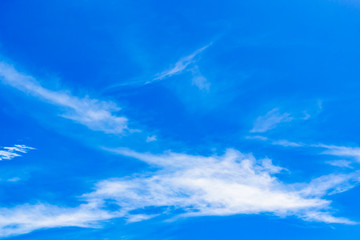 Naklejka na ściany i meble Clouds in the blue sky on a bright sky.