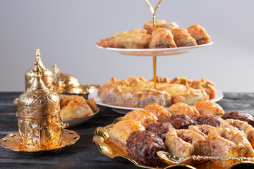 baklava with pistachio. turkish traditional delight on a dark wood background