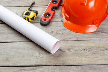 Construction  worker supplies and instruments on wooden background