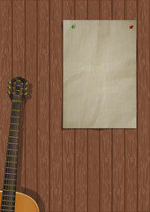 Music background with wooden planks, acoustic guitar and a piece of paper for an inscription or image.