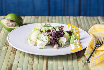 Salad mix with avocado and cucumber, with balsamic dressing
