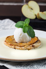 Delicious sweet vanilla ice cream dessert with mint on apple pie