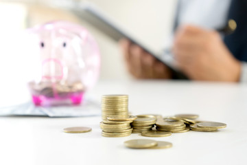 Business man woman hold collect coin in the row in