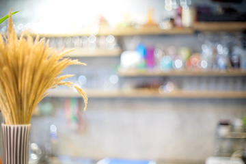 blur wood cupboard in restaurant with rice flower