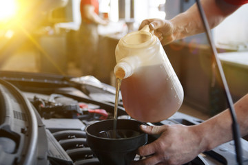 Hand mechanic in repairing car,Change the Oil - Image