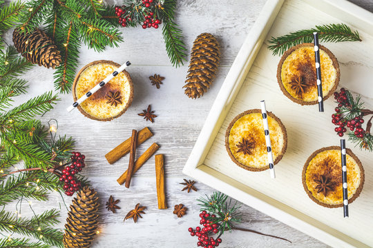 Homemade eggnog in glasses, top view, copy space