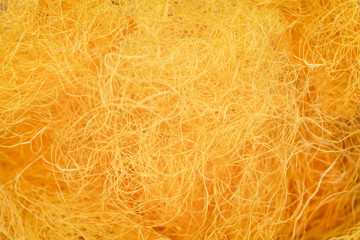 Raw gold silk thread texture for background,made from cocoons of silkworm