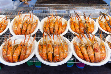 Grilled shrimps seafood on the table in market of Bangkok Thailand 