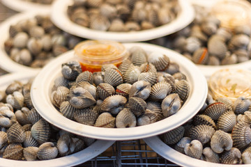 Steamed blanched cockles for cooking dinner with family at street food of Thailand