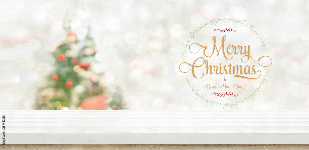 Poster merry christmas and happy new year wreath at white wood table top at blur bokeh christmas tree decor