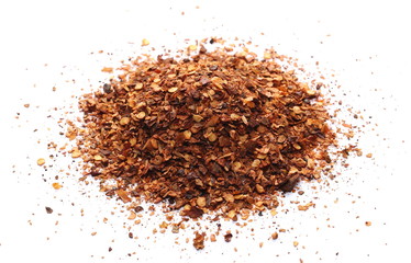 Crushed, ground red cayenne pepper, spicy chopped paprika isolated on white background