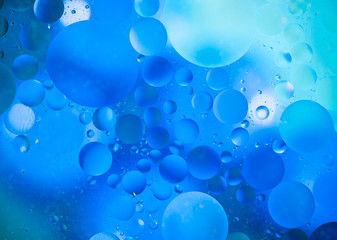 water drops on glass with colorful background, close-up 