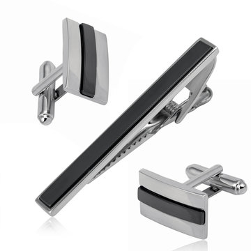 Set of silver tie clip and cuff links isolated on white