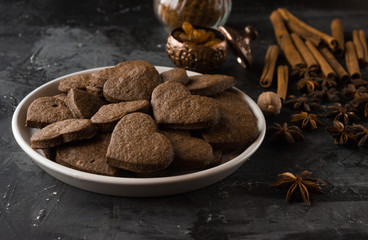 Vegan heart gingerbread cookies on dark background