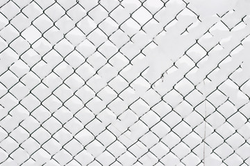 Wire fence covered snow winter white