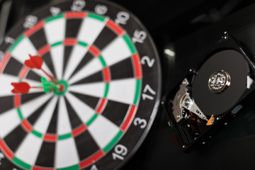 Winchester Darts at targets on dark background