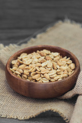 Peanuts on grey wooden table