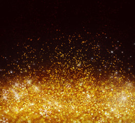 Gold bokeh or glitter lights on dark background with empty place for your text.