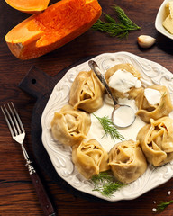 Asian steamed dumplings Manti with pumpkin and garlic.