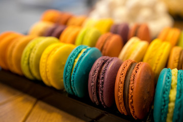 close up of colorful macaroons as background