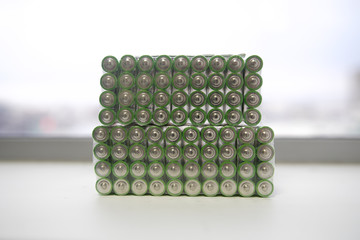 Ecology recycling concept, nature energy, many used or new battery piramide, rechargeable AA...