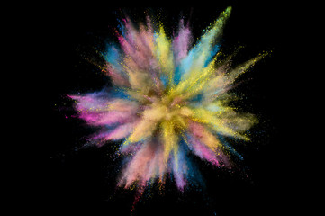 Colored powder explosion. Abstract closeup dust on backdrop. Colorful explode. Paint holi
