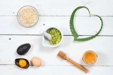 Ingredients for face mask; avocado, aloe vera, egg, oatmeal, honey